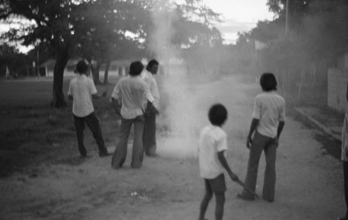 Boys playing with fireworks, La Chamba, Colombia, 1975