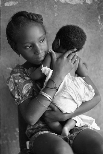 Girl holding a baby, San Basilio de Palenque, 1977