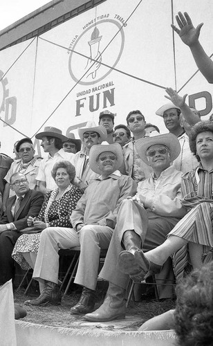 Presidential candidate Ángel Aníbal Guevara and his running mate Ramiro Ponce Monroy sit at a campaign rally, Guatemala City, 1982