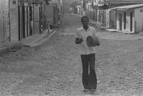 A man walking with his drum, Barbacoas, Colombia, 1979