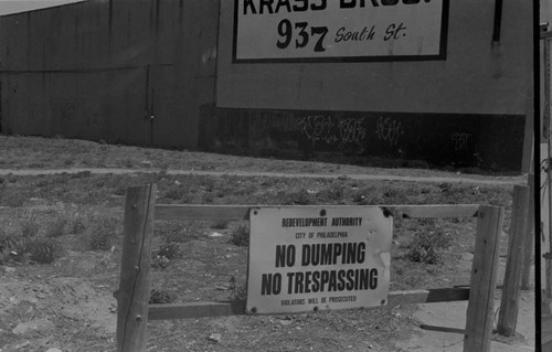 Vacant lot with signs and graffiti, Philadelphia, ca. 1980