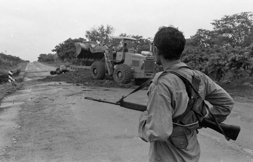 Sandinista stands near a bridge, Nicaragua, 1979