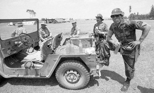 General Benedicto Lucas Garcia resting on a vehicle, Santa Cruz del Quiché, 1982