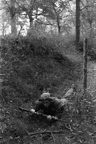 Survival school student holds a rifle, Liberal, 1982