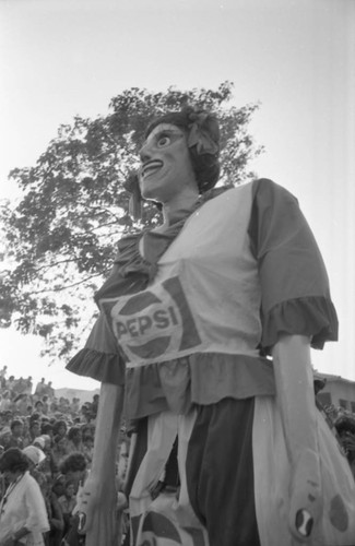 Giant carnival figure walking in the street, Barranquilla, Colombia, 1977