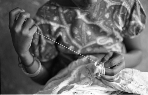 Girl sewing a garment, San Basilio de Palenque, 1977