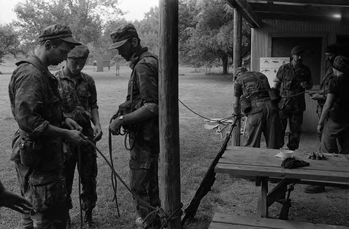 Survival school students tie rope, Liberal, 1982