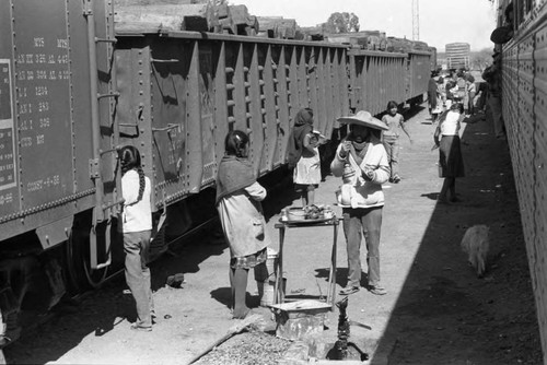 Food vendors at train stop, Mexico, 1983