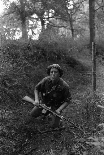 Survival school student holds a rifle, Liberal, 1982