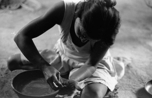 A woman making pottery, La Chamba, Colombia, 1975