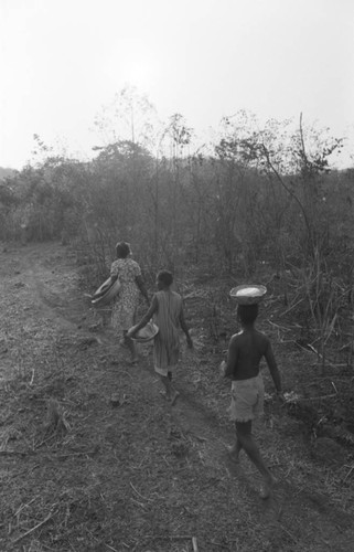 Villagers carrying containers, San Basilio de Palenque, Colombia, 1977