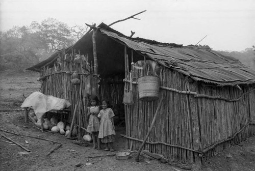 Refugee children in a hut of logs, Chiapas, 1983