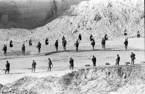 U.S. advisors training Salvadoran soldiers at a shooting range, Ilopango, 1983