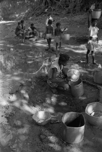 Girl collecting water at river, San Basilio de Palenque, ca. 1978