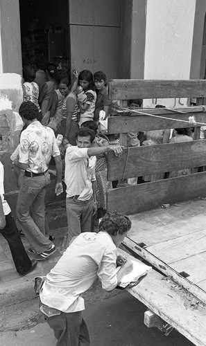 People line up outside of a building, Nicaragua, 1979