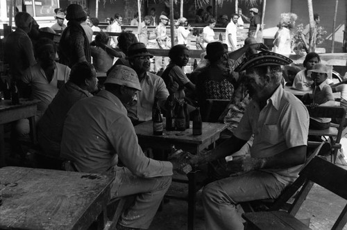 Men sitting at a restaurant, Barranquilla, Colombia, 1977