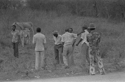 Men in conversation near cemetery, San Basilio de Palenque, Colombia, 1977