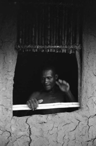 Man works on a window, San Basilio de Palenque, 1975