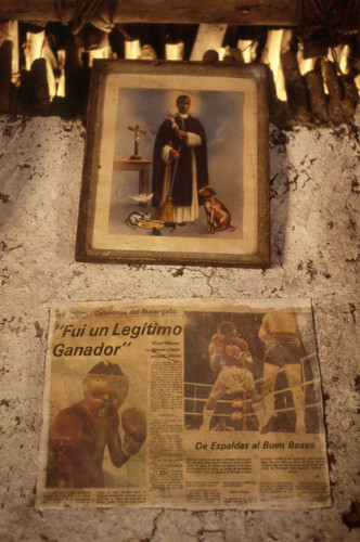 Pictures hanging from a wall, San Basilio de Palenque, 1976