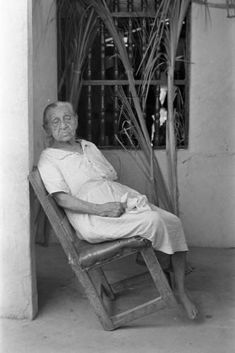 Elderly woman sitting on a veranda, Barranquilla, Colombia, 1977