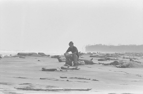 Richard Cross sitting on a log, Isla de Salamanca, Colombia, 1977