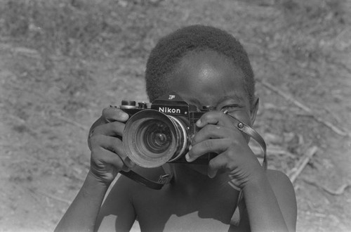 Boy with camera, San Basilio del Palenque, ca. 1978