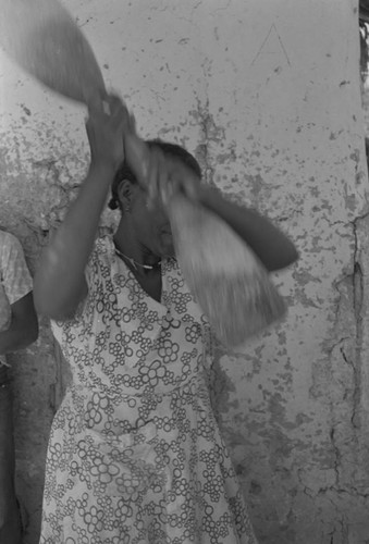 Woman grinding corn, San Basilio de Palenque, ca. 1978