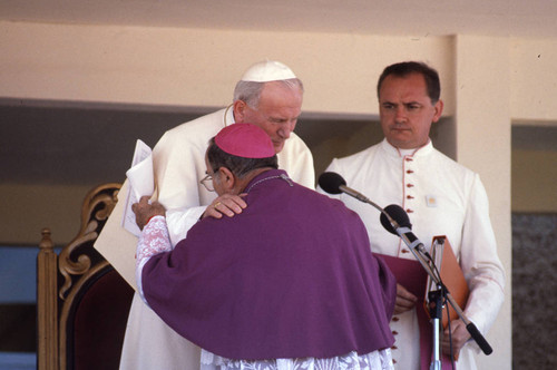 Pope John Paul II embraces a member of the clergy, Managua, Nicaragua, 1983