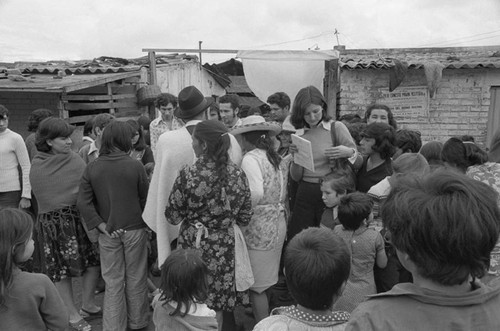 A crowd at a market, Tunjuelito, Colombia, 1977