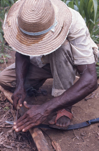 Man sharpening a machete, San Basilio de Palenque, 1976