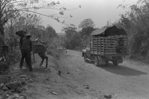 Pick up truck travelling on the road, San Basilio de Palenque, ca. 1978