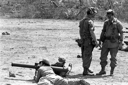 U.S. advisor training Salvadoran soldiers at military base, Ilopango, 1983