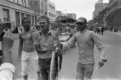 Man carrying a snake, Barranquilla, Colombia, 1977