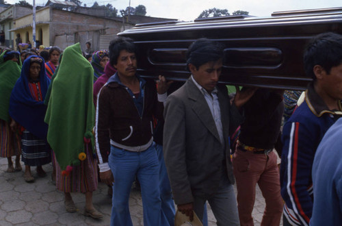 Men carrying a coffin to the cemetery, Patzún, 1982