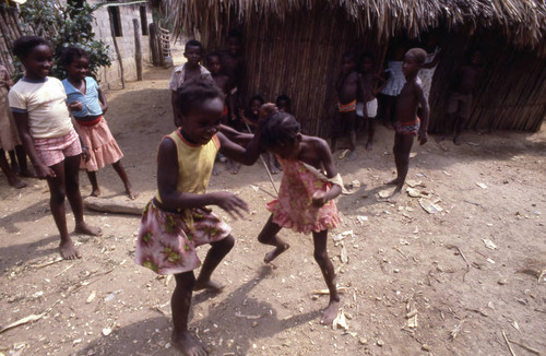 Girls boxing outdoors, San Basilio de Palenque, 1976