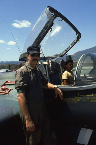 A U.S. advisor and cadet aboard a cessna a-37 dragonfly, Ilopango, San Salvador, 1983