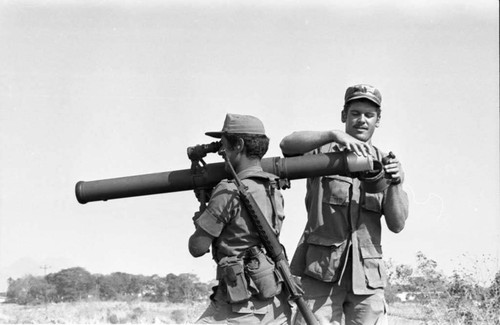 A U.S. military advisor training a Salvadoran soldier at Ilopango Military Base, Ilopango, 1983