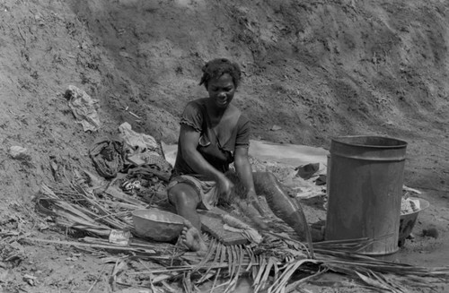 Woman washing clothes, San Basilio de Palenque, 1977