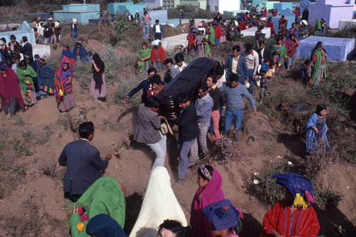 Mayan men carrying a coffin through a cemetery, Patzún, 1982