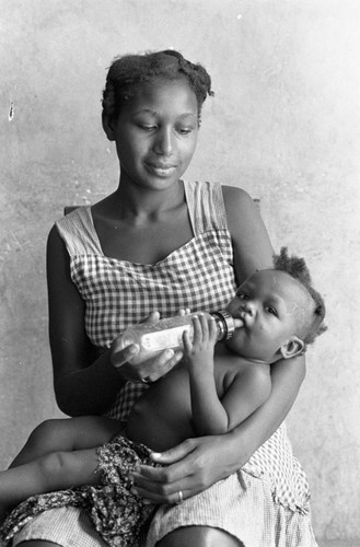 Woman feeding a baby, San Basilio de Palenque, 1976