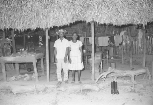 Couple standing under a porch, San Basilio de Palenque, 1976