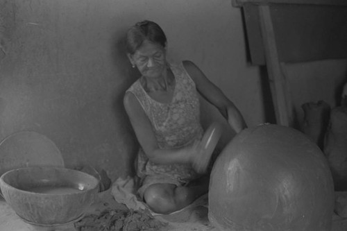 A woman making pottery, La Chamba, Colombia, 1975