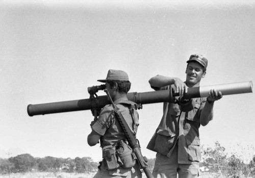 A U.S. military advisor training a Salvadoran soldier at Ilopango Military Base, Ilopango, 1983