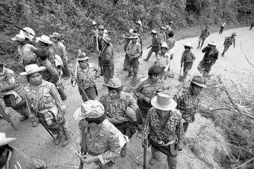 Civilians waiting to repair a bridge, Chichicastenango, 1982