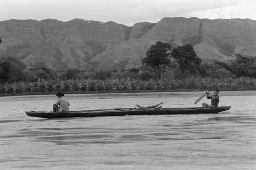 Two men on the Magdalena River, La Chamba, Colombia, 1975