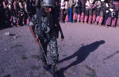 A soldier walking, Nahualá, 1982