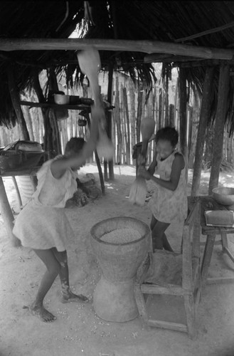 Girls pounding grain in a mortar, San Basilio de Palenque, 1976