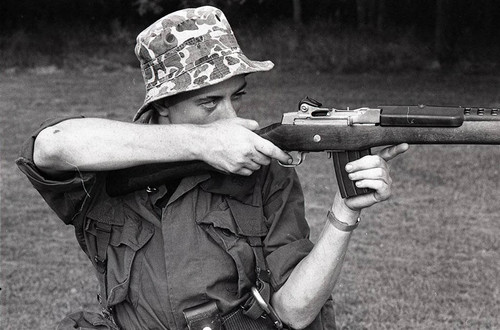 Survival school student holds a gun, Liberal, 1982