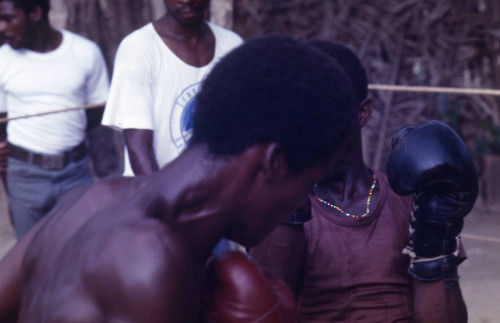 Boxers fighting inside ring, San Basilio de Palenque, 1976