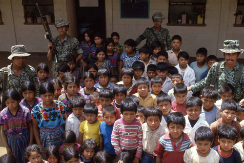 School children stand surrounded by four soldiers, Zaragoza, 1982